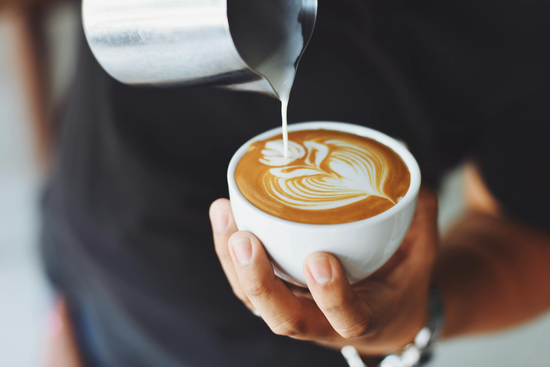 Coffee is poured by a person