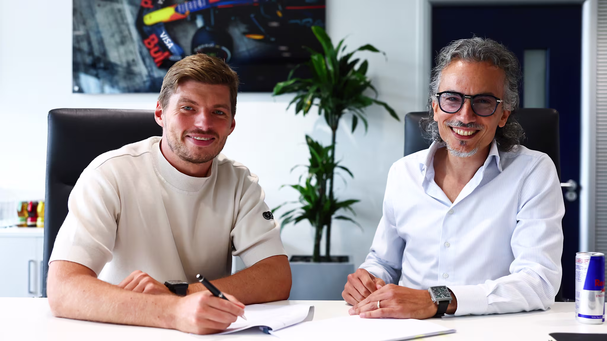 Max Verstappen signing a contract with Red Bull (Image via Formula 1 Corporation)