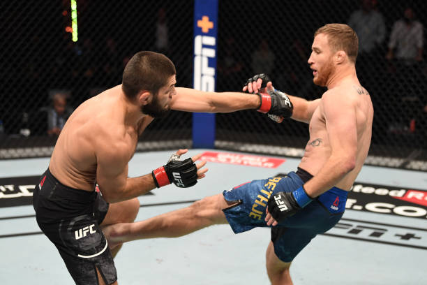 Justin Gaethje kicks Khabib Nurmagomedov during their UFC 254 lightweight title bout in Abu Dhabi on October 25, 2020. (Photo by Josh Hedges/Zuffa LLC via Getty Images)
