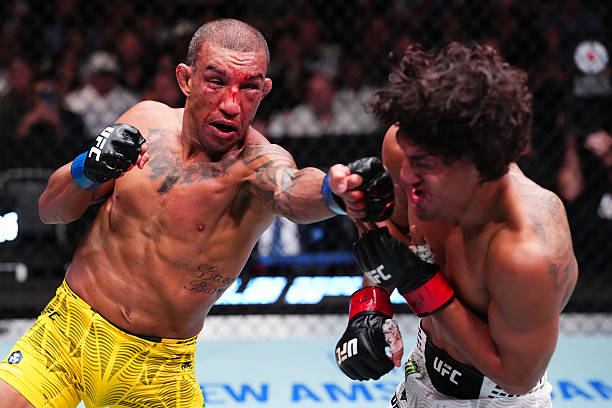 Raul Rosas Jr. punches Raoni Barcelos of Brazil in a bantamweight fight during the UFC Fight Night event