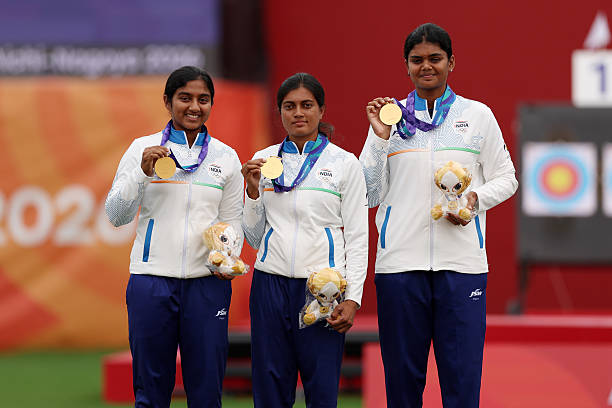 Gold medalists Chikitha Taniparthi, Prithika Pradeep and Jyothi Surekha Vennam of India pose on the podium at the medal ceremony for the Archery Compound Women's Team on day eleven of the 20th Asian Games