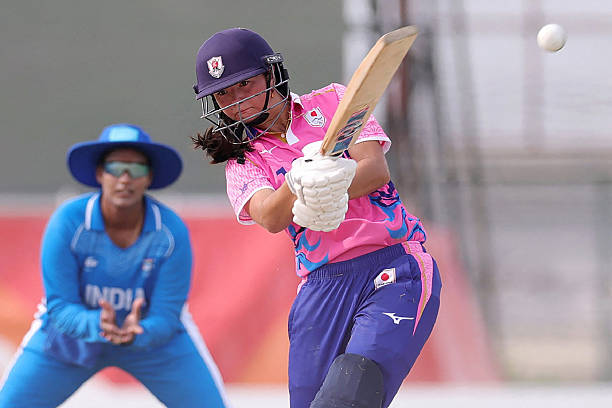 Japan's Ayaka Kato Stafford (C) hits a shot during the cricket match between Japan and India at the 2026 Women's Asian Games