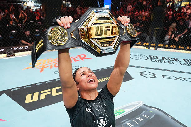 Natalia Silva of Brazil celebrates after defeating Wang Cong in the UFC flyweight championship fight during the UFC 332 event