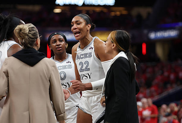 A'ja Wilson #22 of the Las Vegas Aces is visibly upset after entering the stands to confront a fan during game two of the first round of the WNBA Playoffs against the Indiana Fever